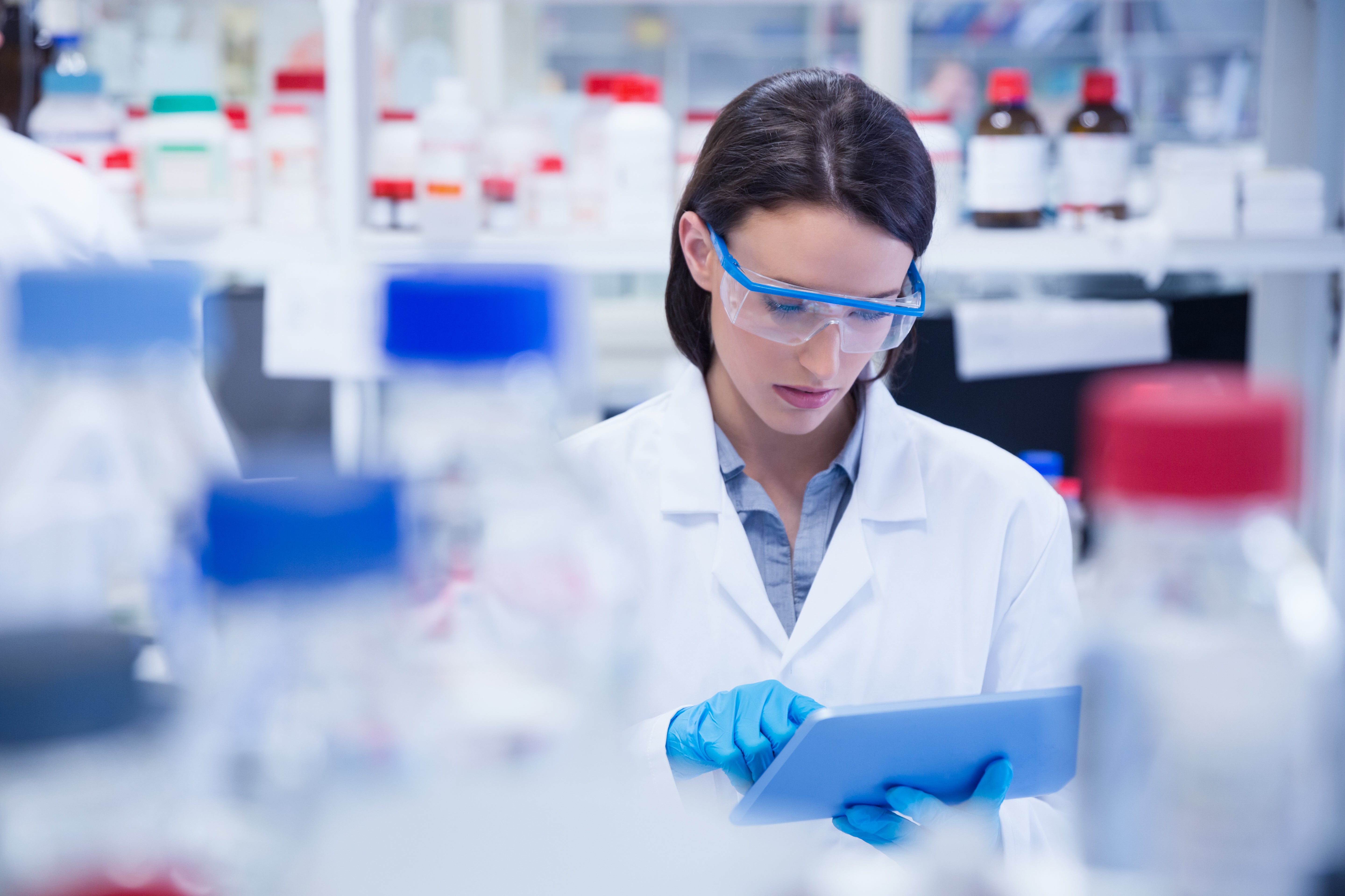 Woman scientist using a tablet
