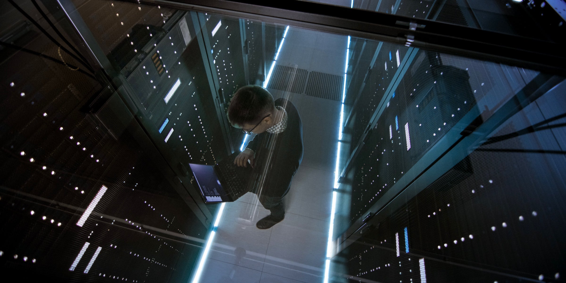 Top down view of man working in a data center 