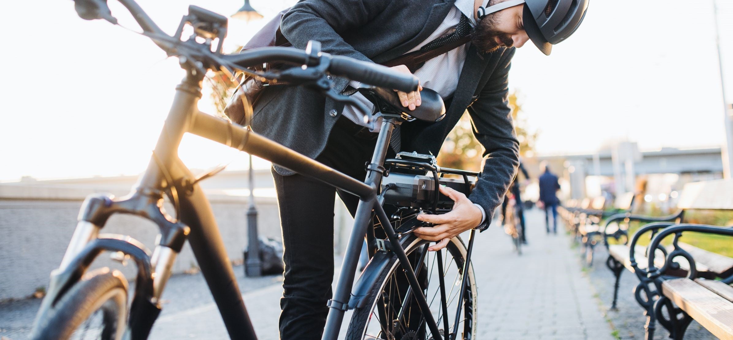 Commuter setting up an electric bicycle in the city