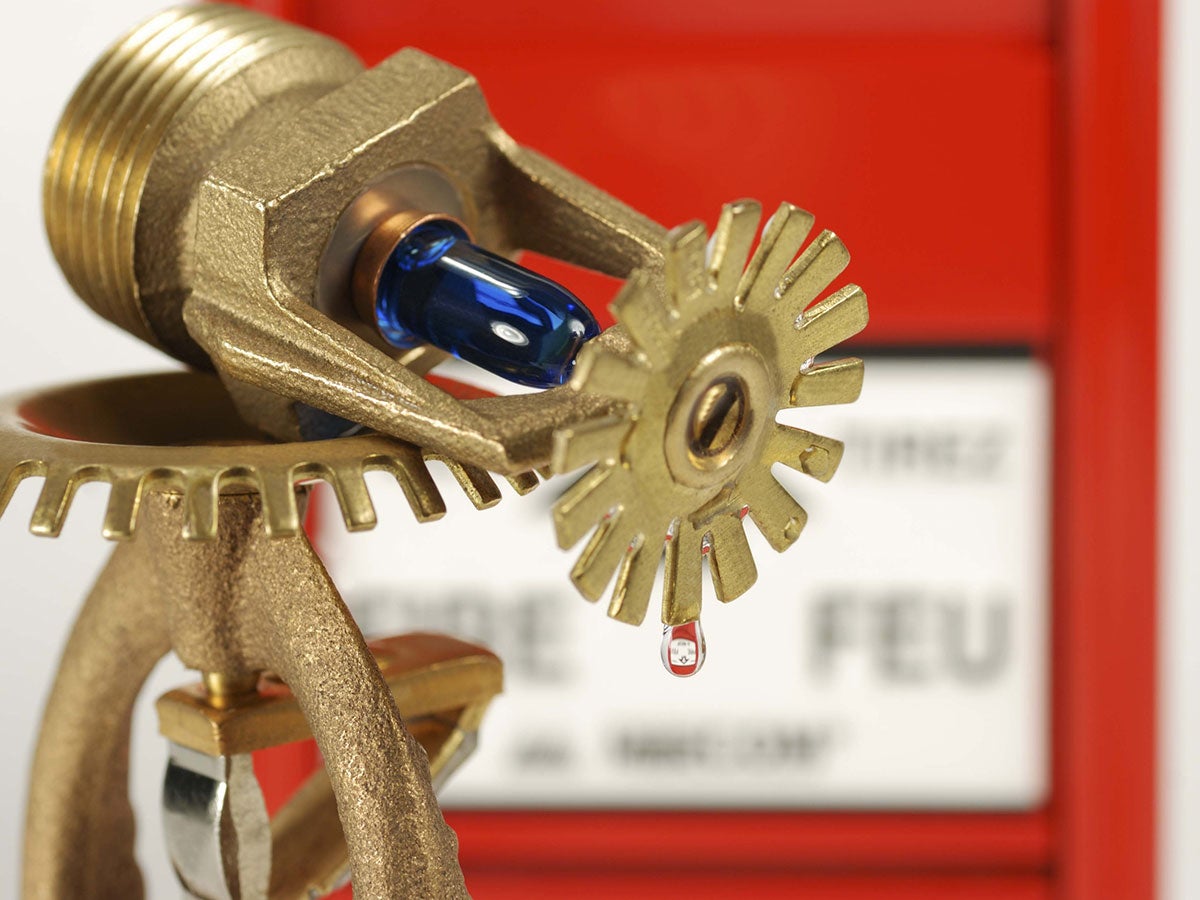 A droplet of water coming off a fire sprinkler