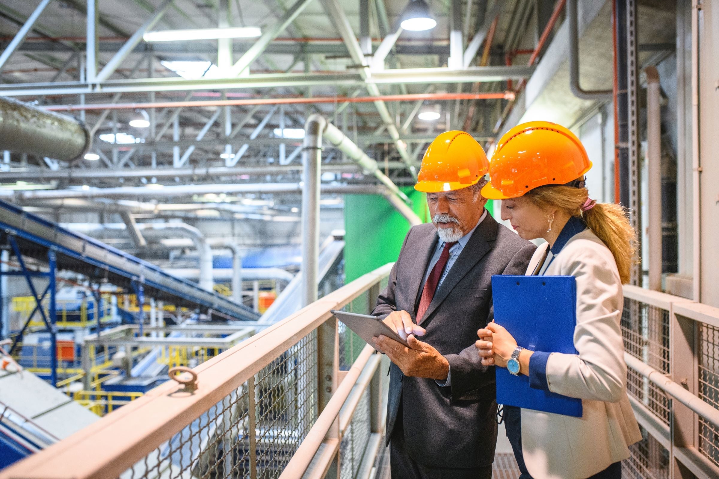 Manager and quality controller inside recycling facility.