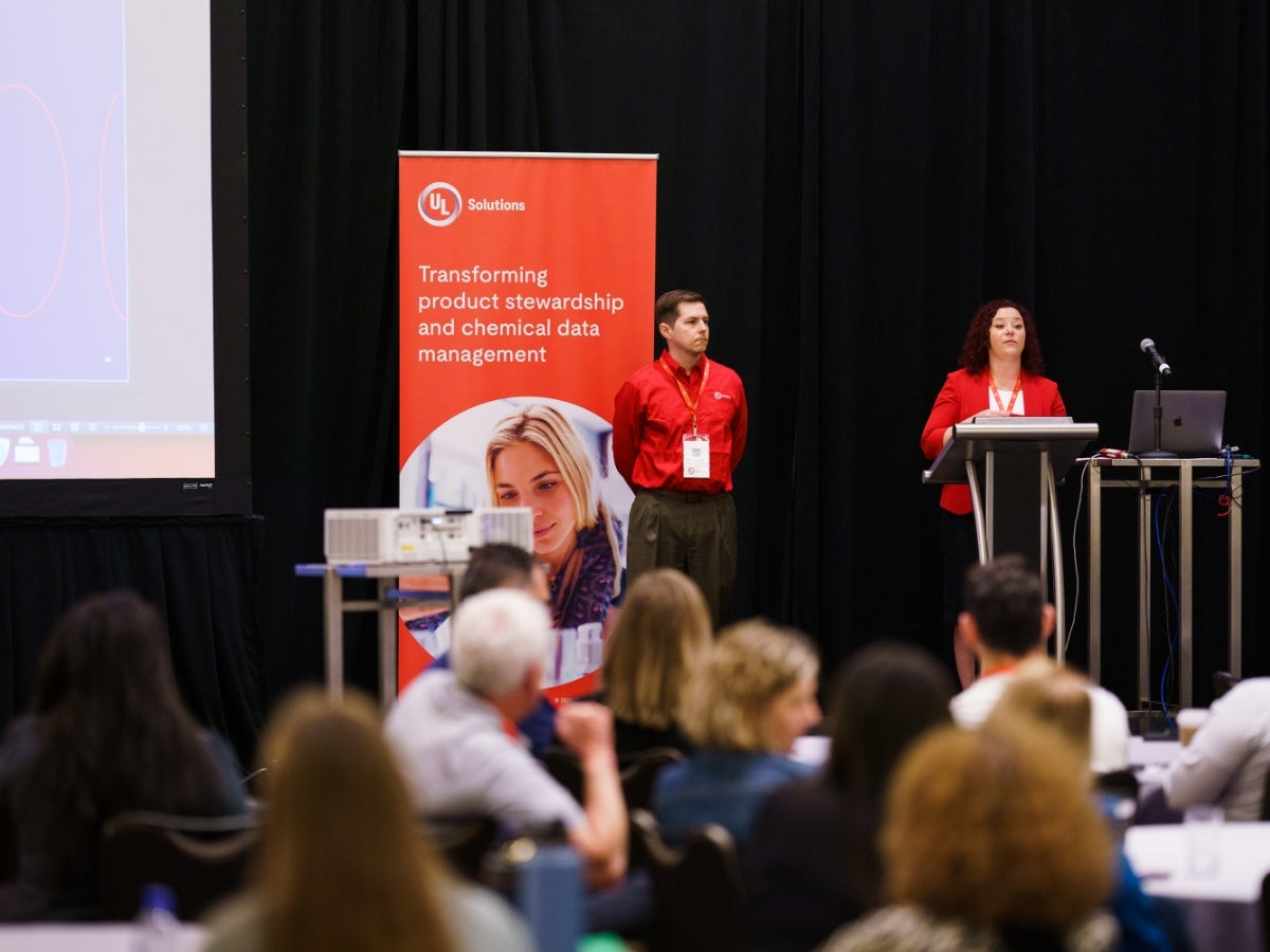 UL Solutions employee giving a presentation in a large conference room