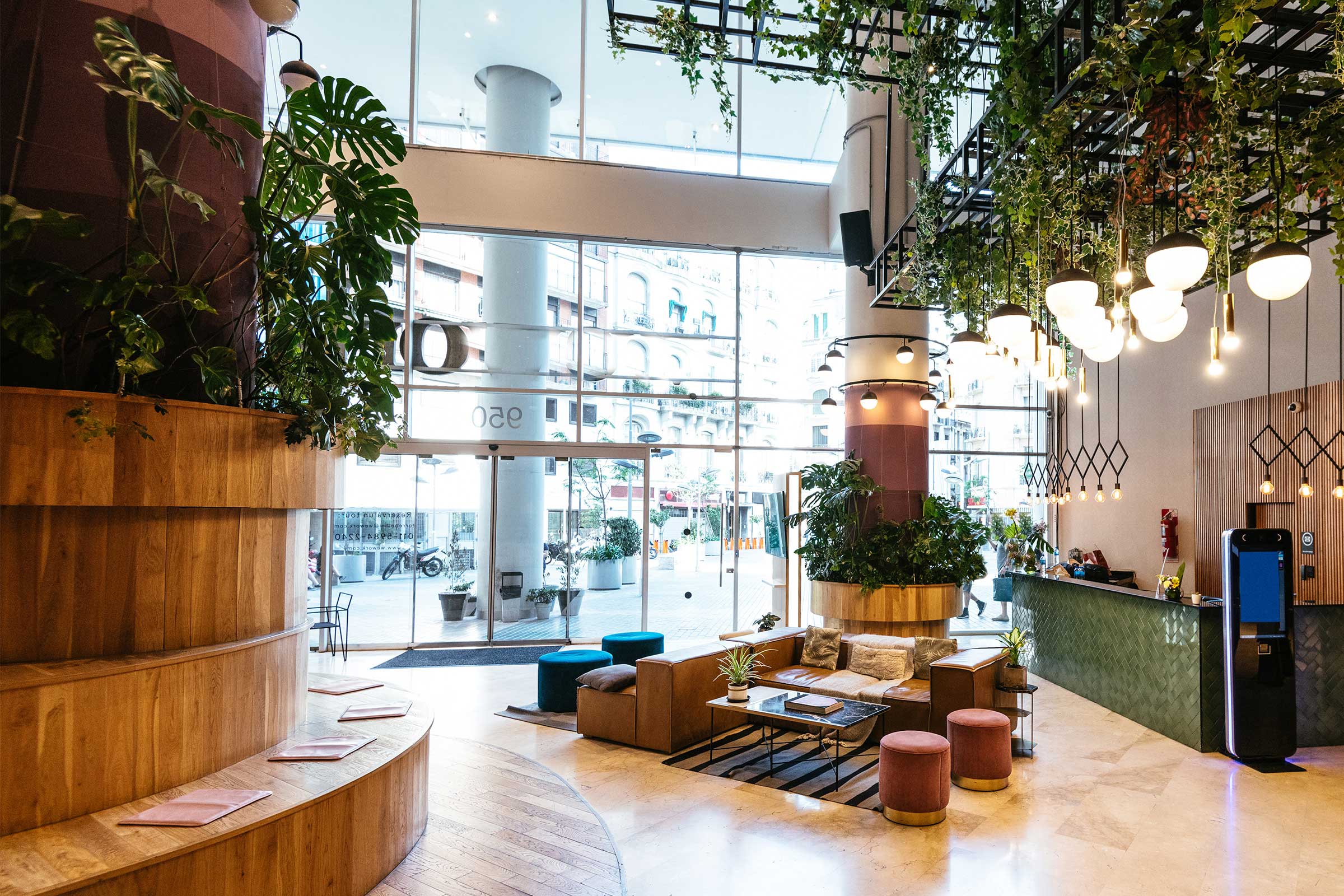 Interior of modern hotel lobby with lots of green plants