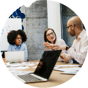 Three people at a table collaborating