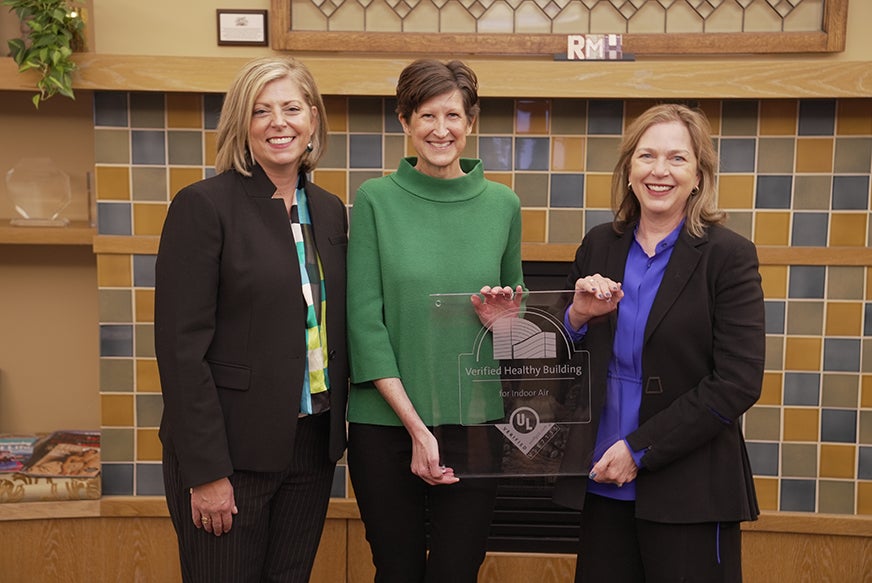 Jennifer Scanlon, president and CEO of UL Solutions, presents a plaque displaying the UL Verified Healthy Building Mark to Ronald McDonald House Charities of Chicagoland & Northwest Indiana