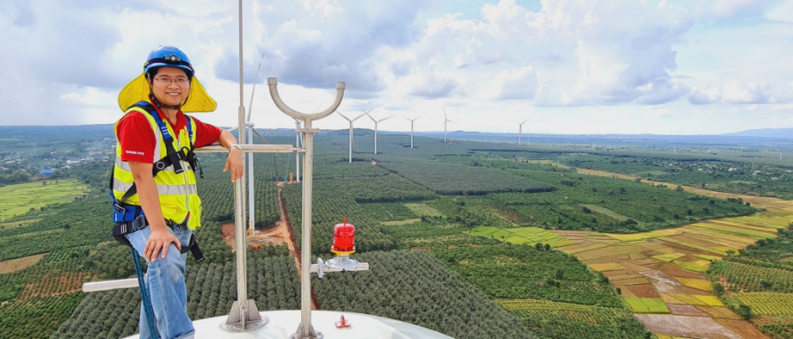 UL Solutions engineer standing on top of a wind turbine