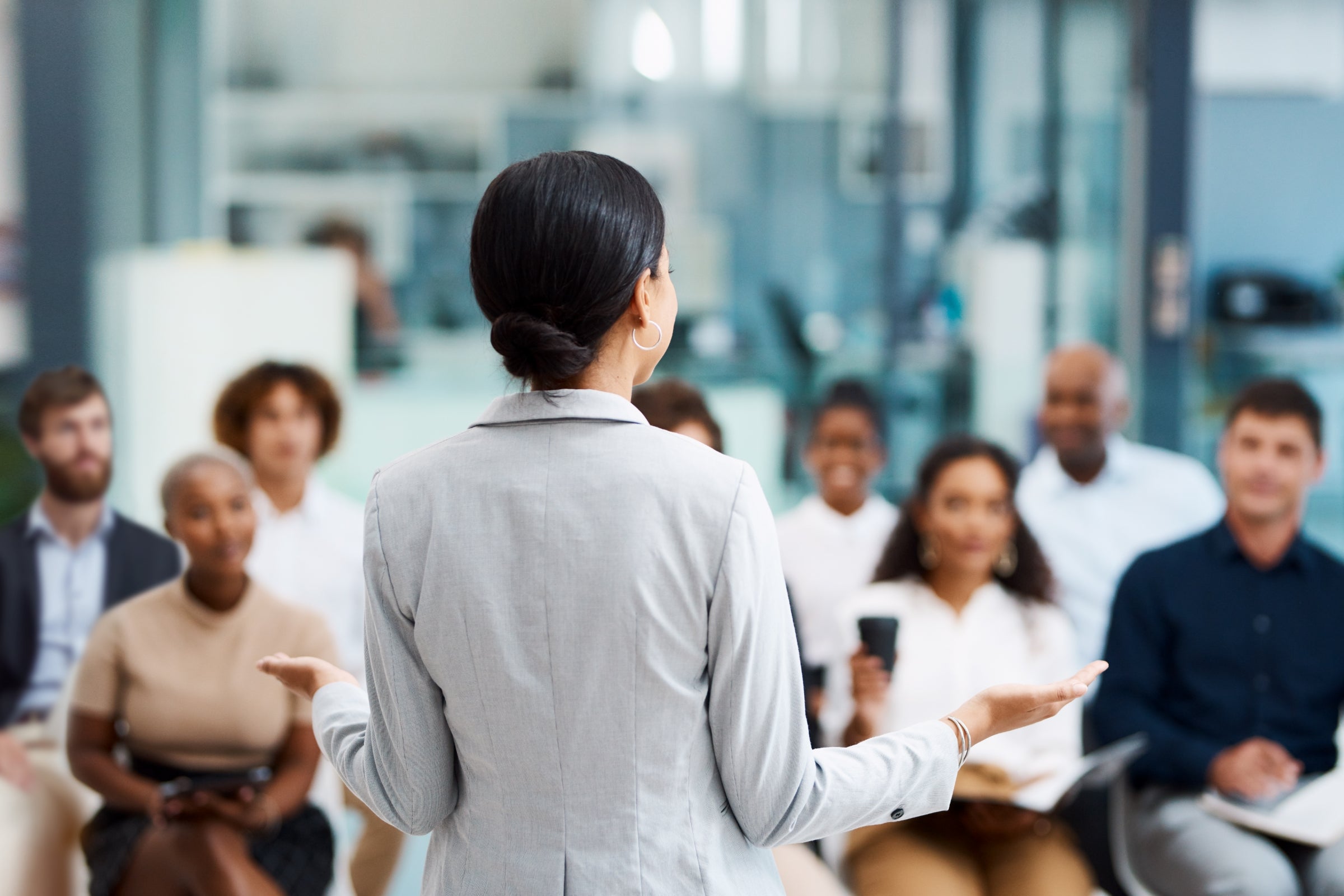 Businesswoman giving a presentation in the office boardroom.