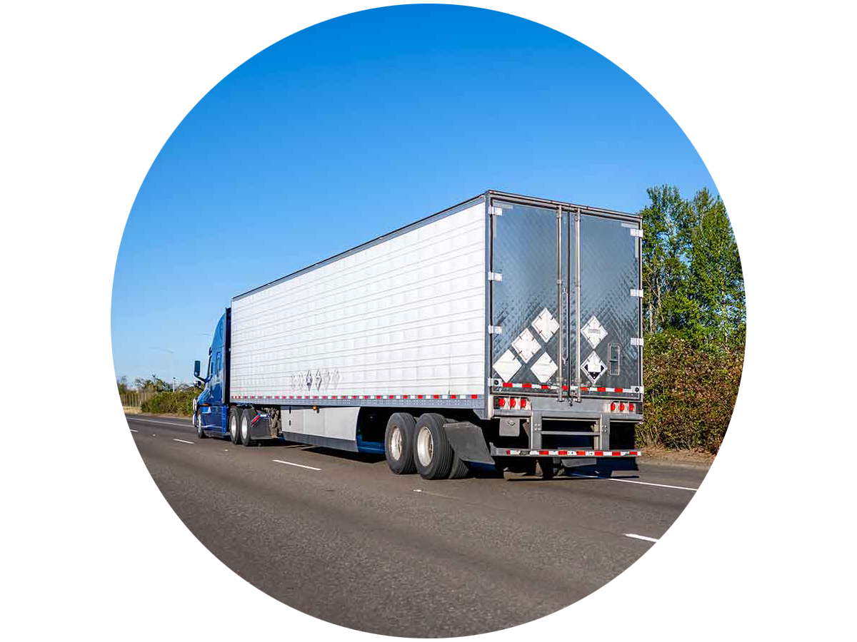 A review of a semi truck driving on the highway