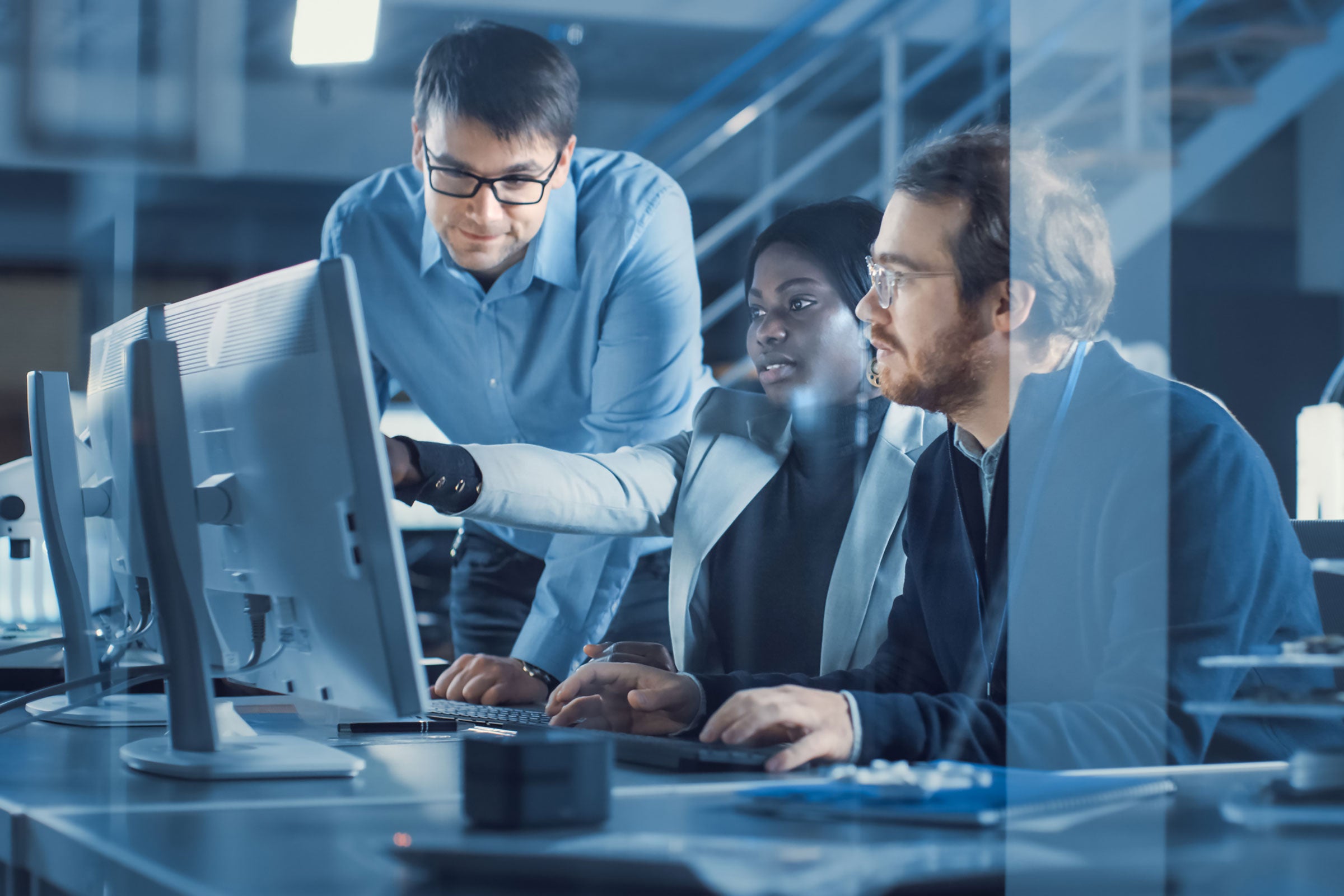 Three engineers working together