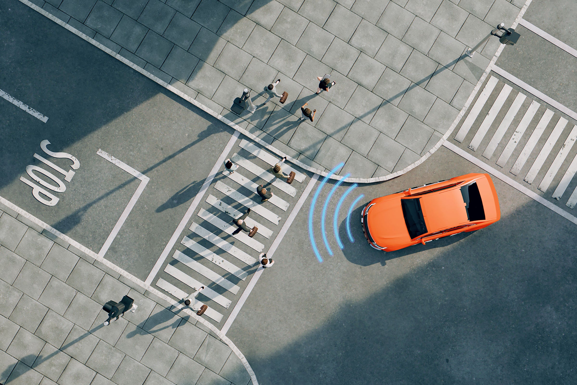 Ariel view of an orange car on a street