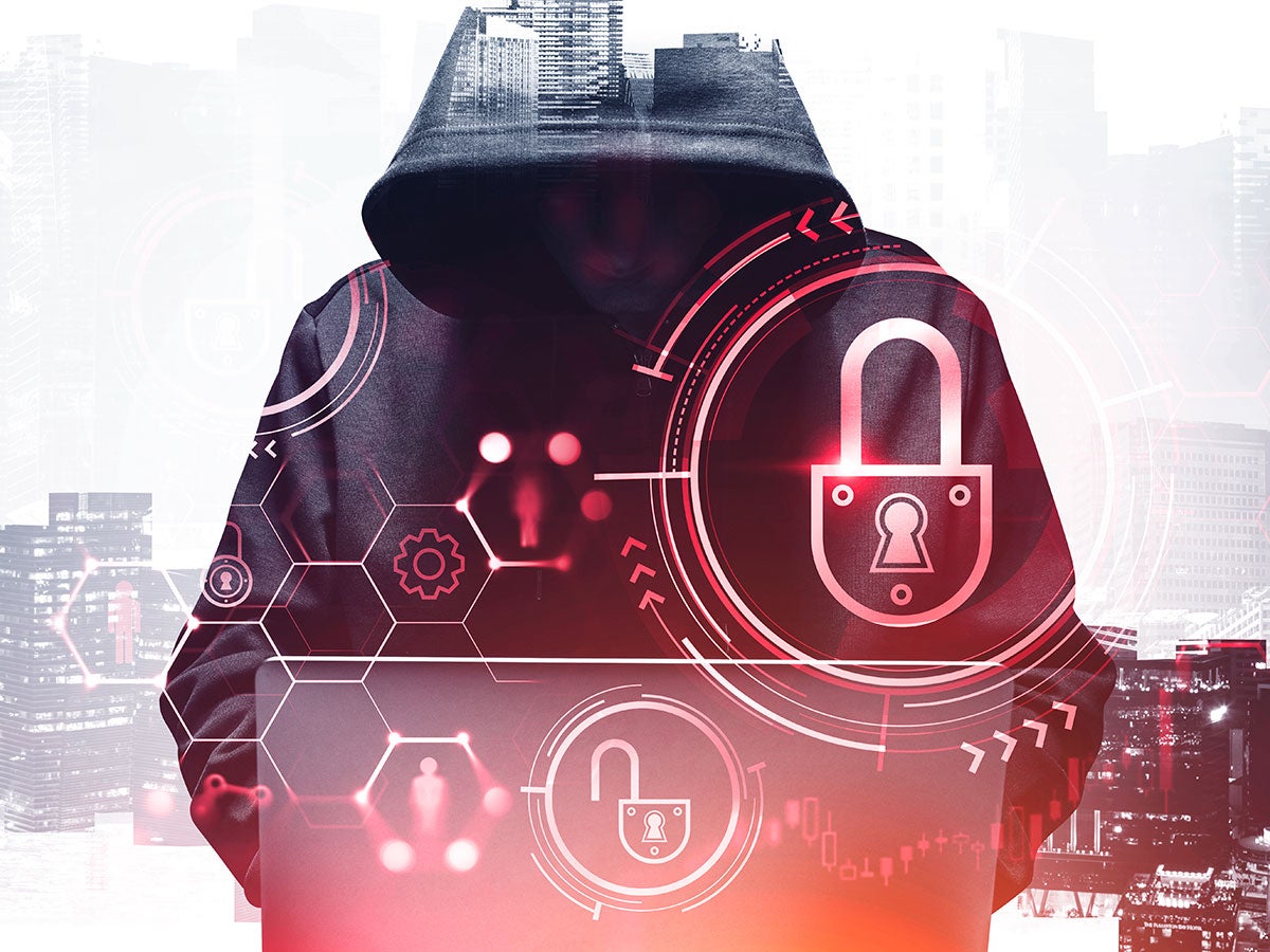 A hooded person representing cybersecurity threat