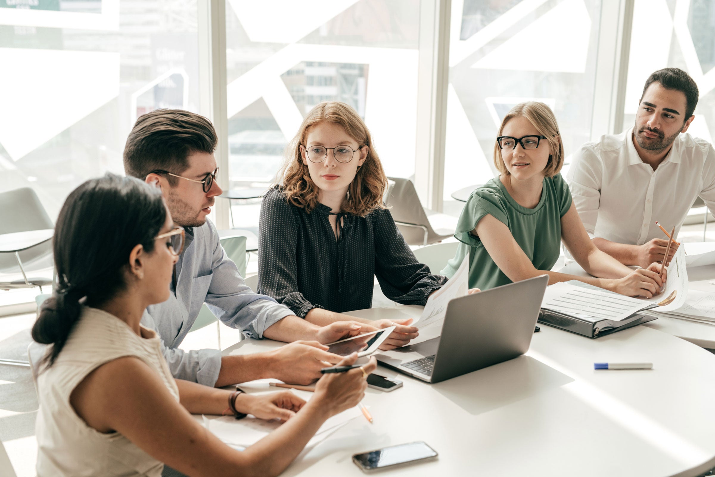 people around a meeting table