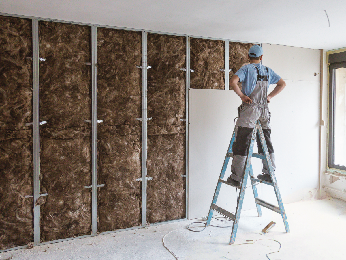Person on ladder at construction site