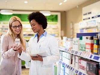 A pharmacist helping a customer