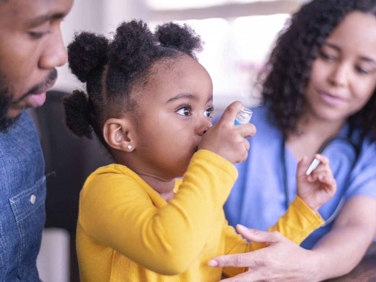 Little girl using an inhaler