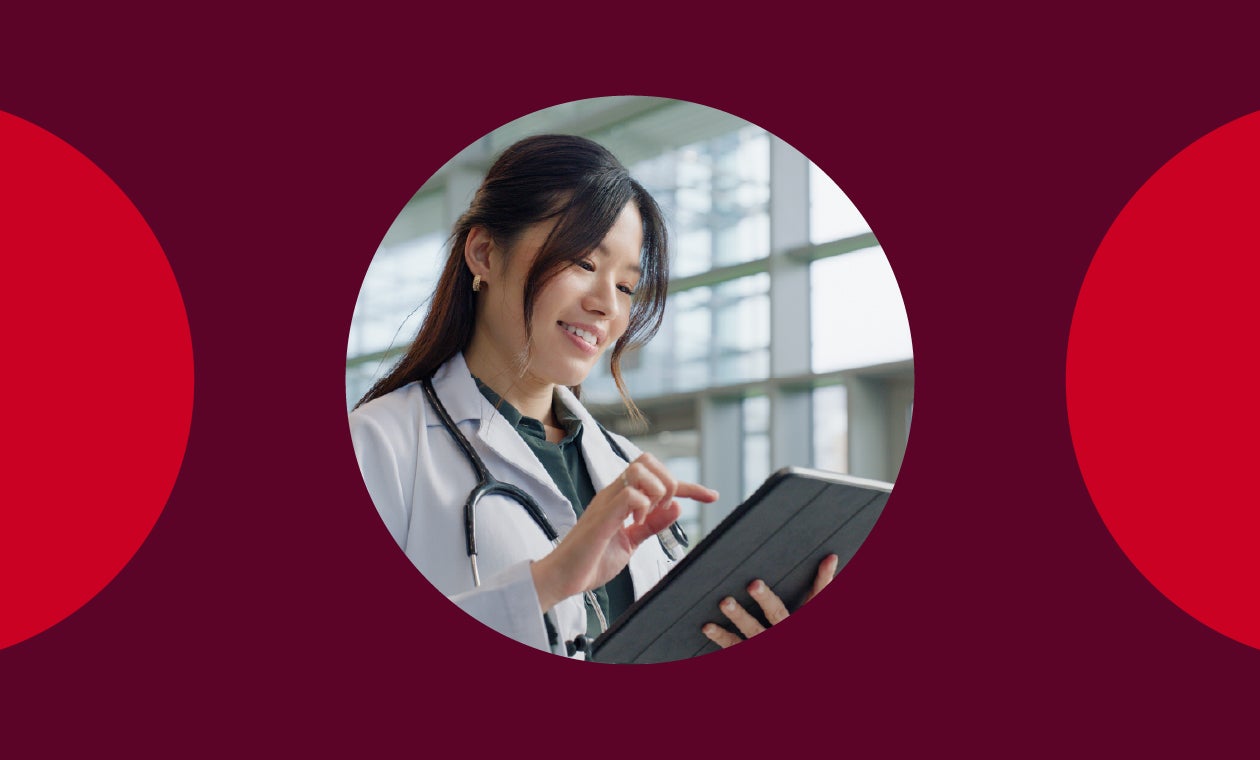 A doctor holding a tablet