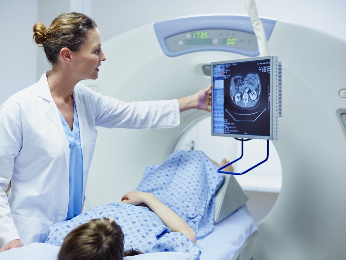 Doctor showing patient the results from a CT scan