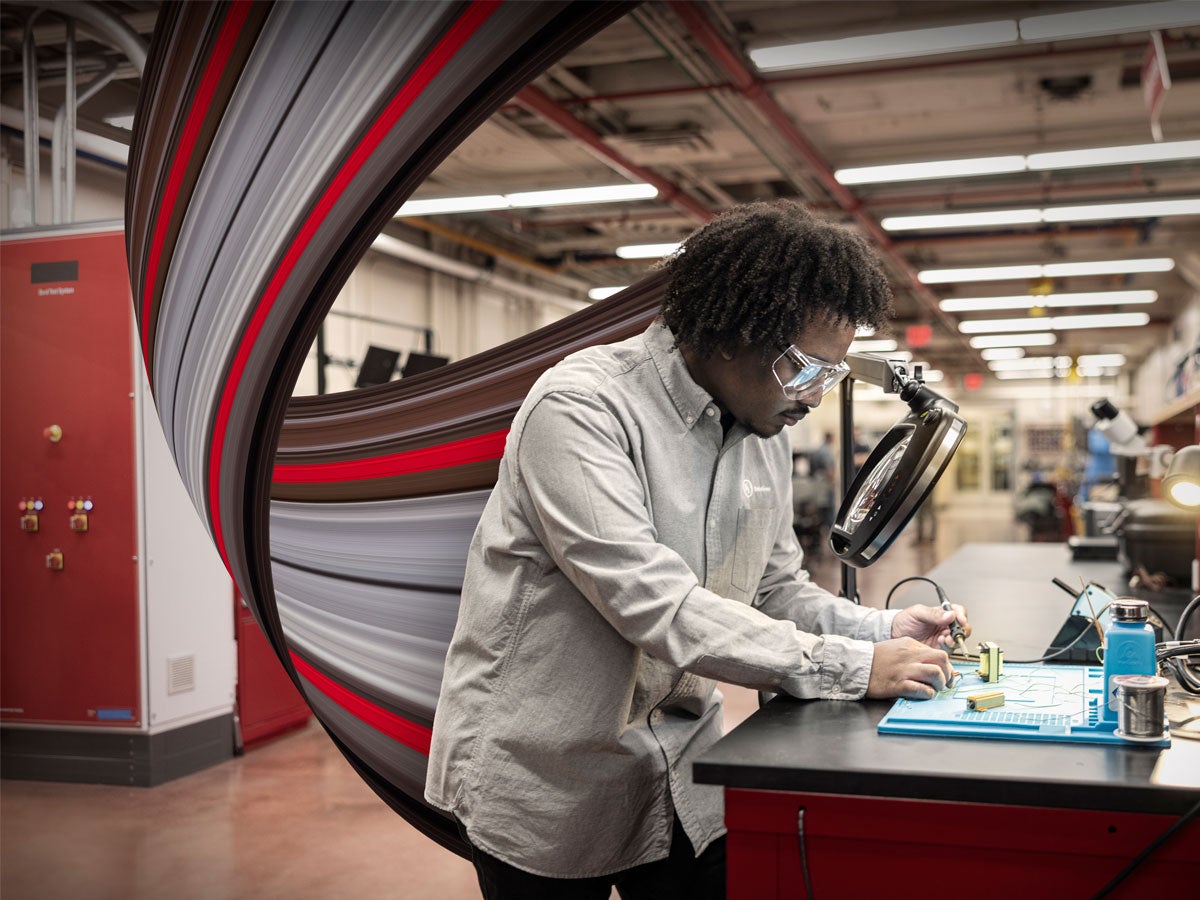 An engineering technician working at a lab.