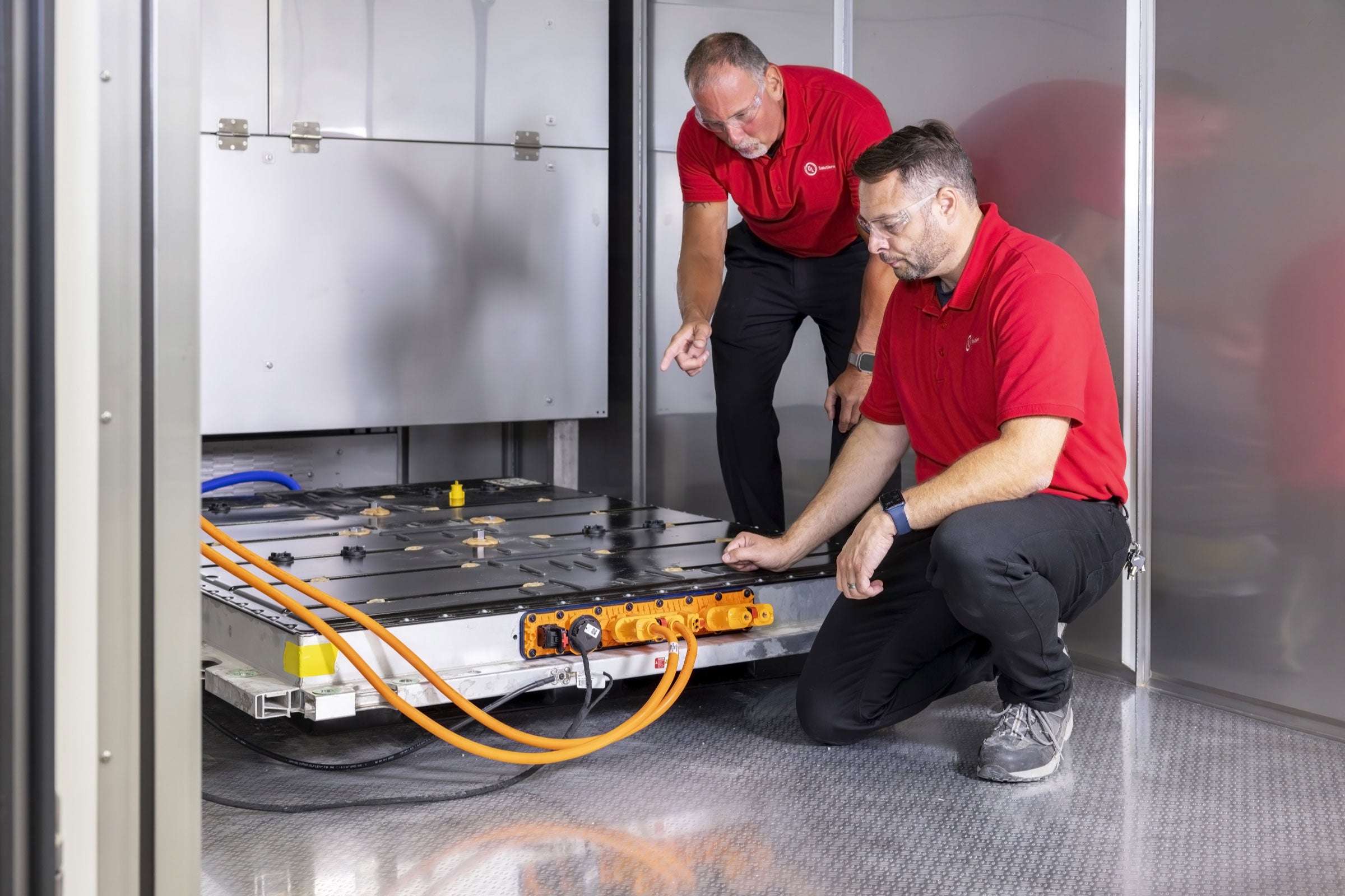 UL Solutions personnel testing an EV battery