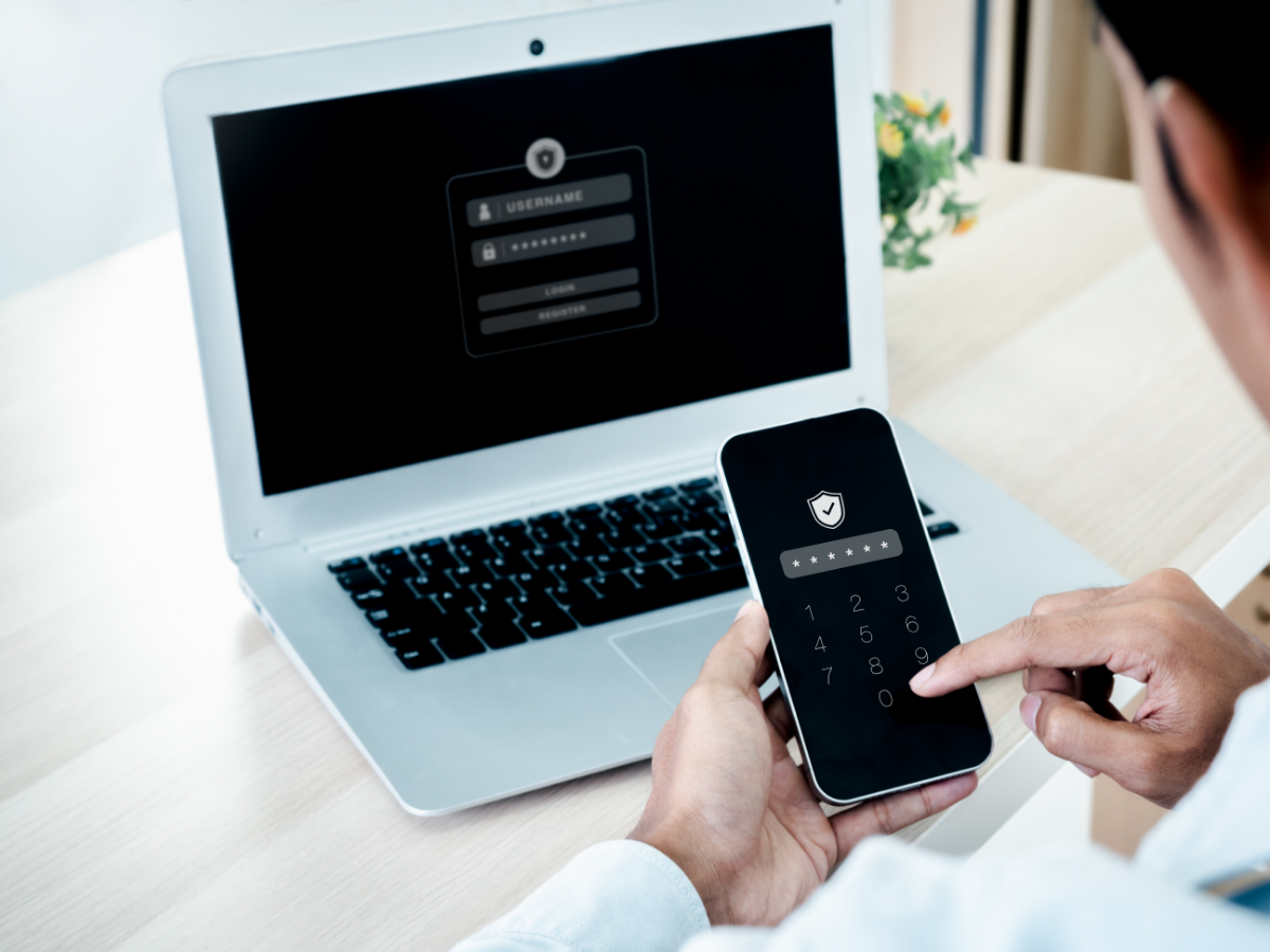 Person using two factor identification with a laptop and mobile device