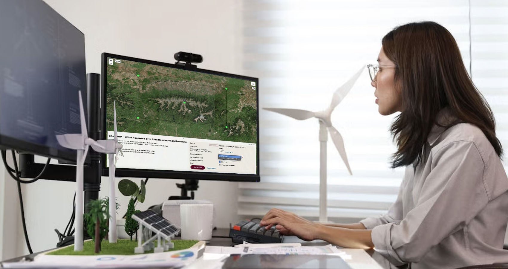 Woman using Windnavigator on computer