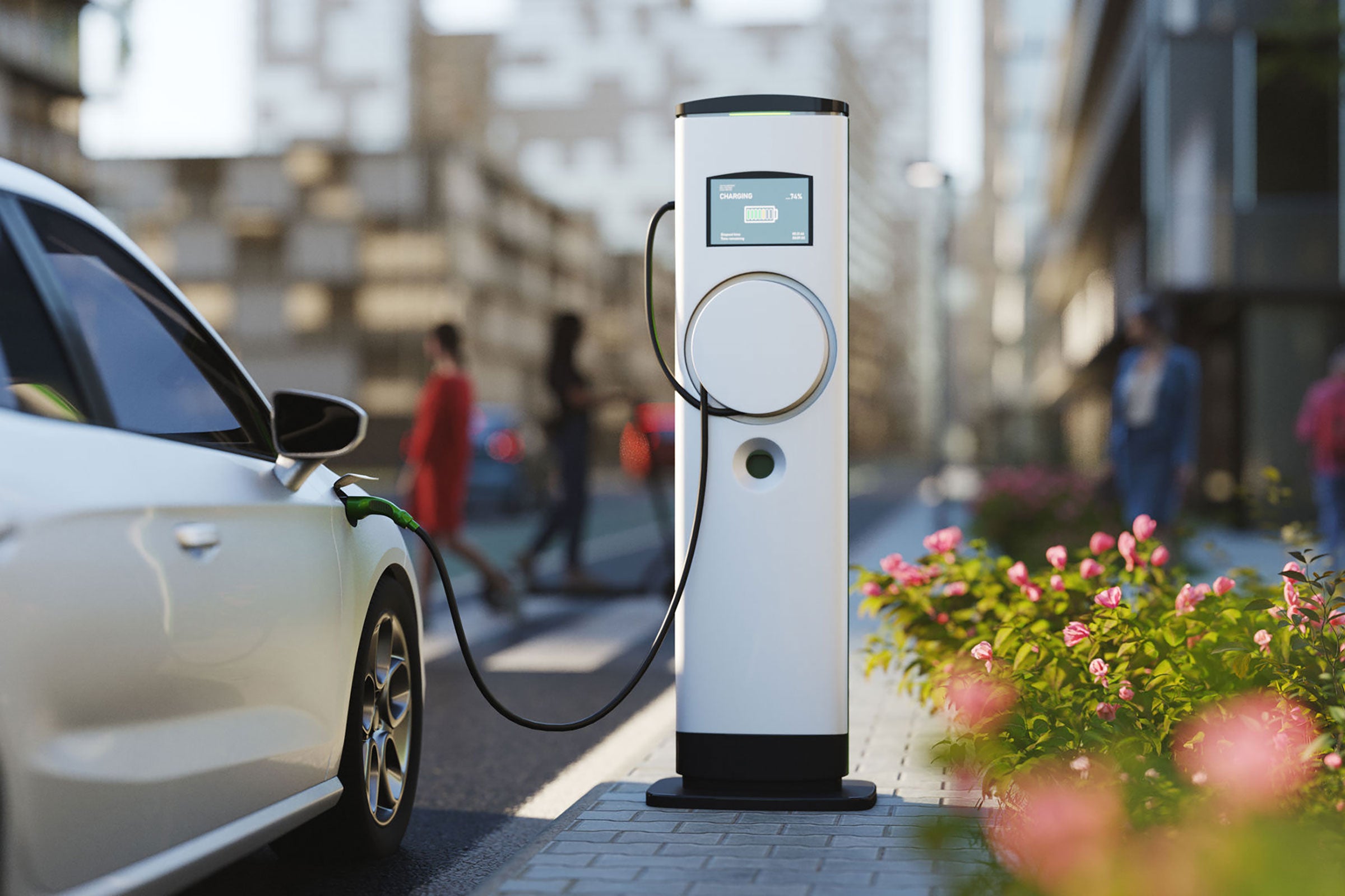 An electric vehicle charging at a charging station