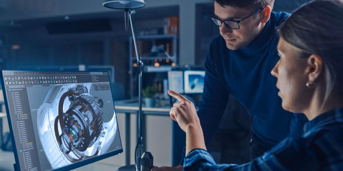 Two engineers working on a modeling and simulation program
