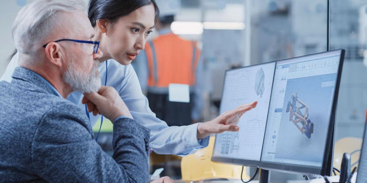 Two engineers working on a modeling and simulation program