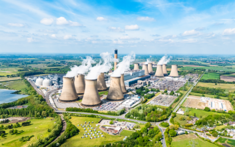 Overhead view of a power station giving off emissions