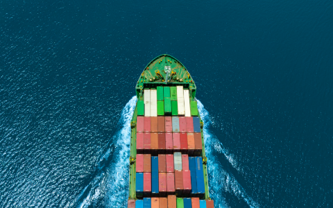 Shipping container sailing in the open sea