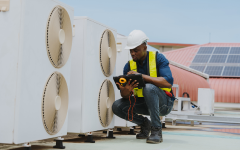 Engineer checking the air conditioning and cooling system in a commercial building.