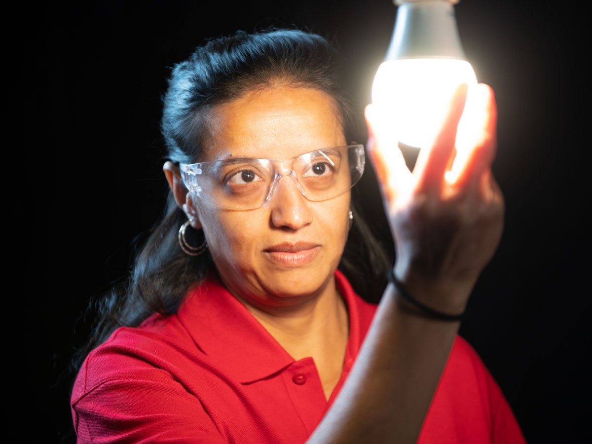 Laboratory staff at the UL Solutions Laboratory observes a lamp about to be tested.