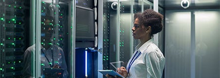 Female IT worker in server room