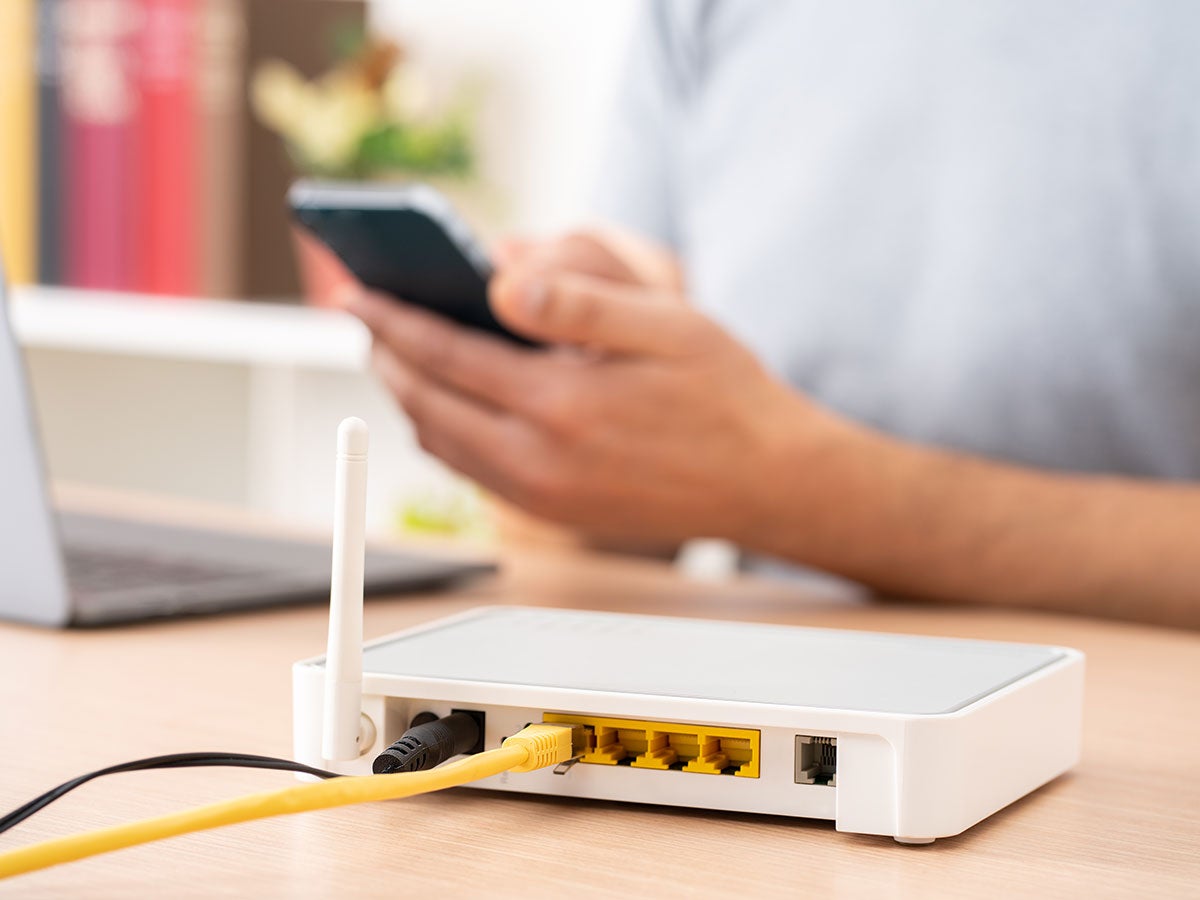 Person working next to a wireless router