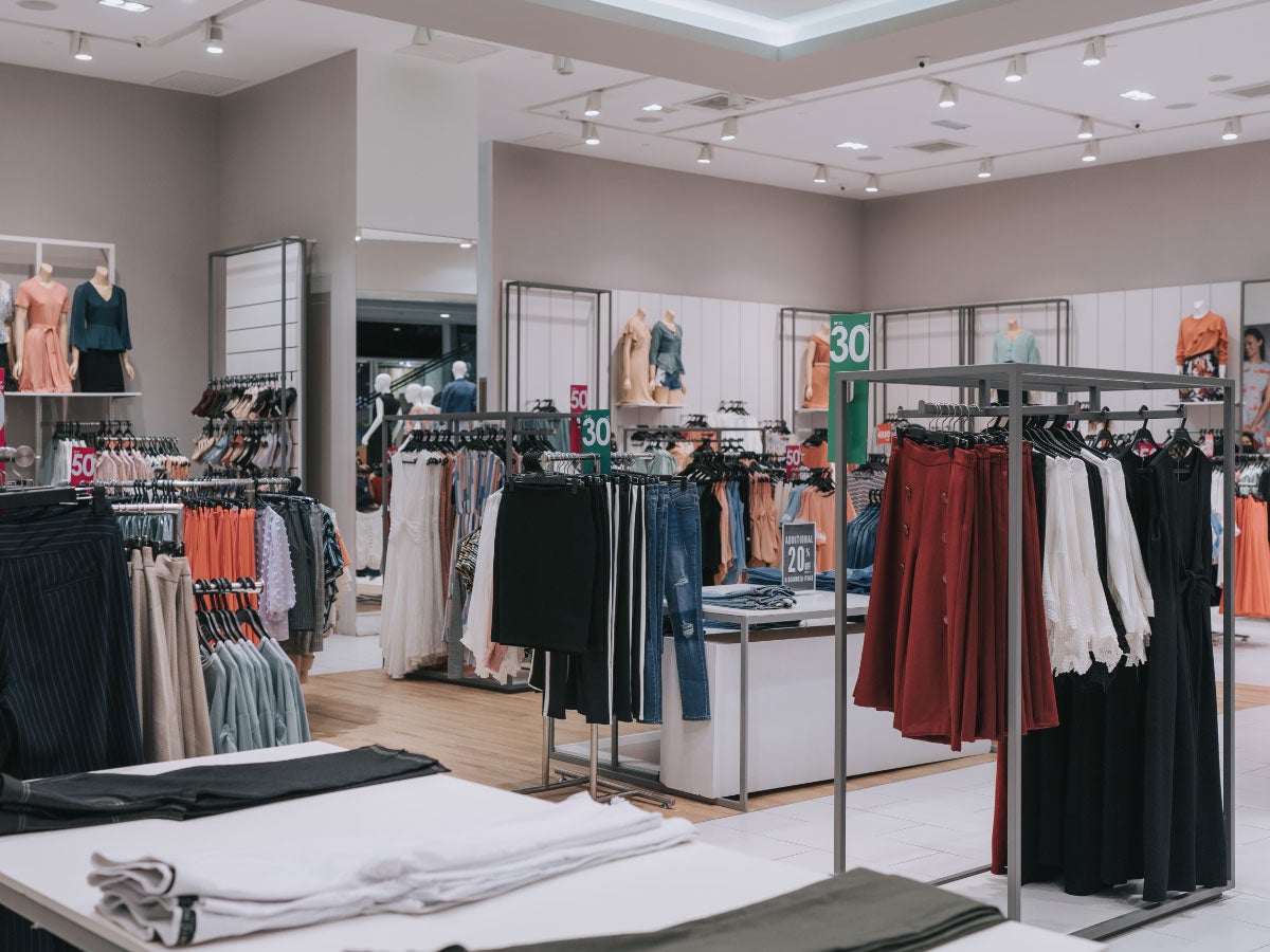 Clothing store retail display in shopping mall with discount sales tag