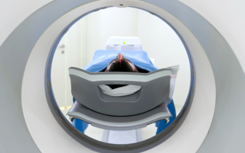 Rear view of a patient receiving an MRI