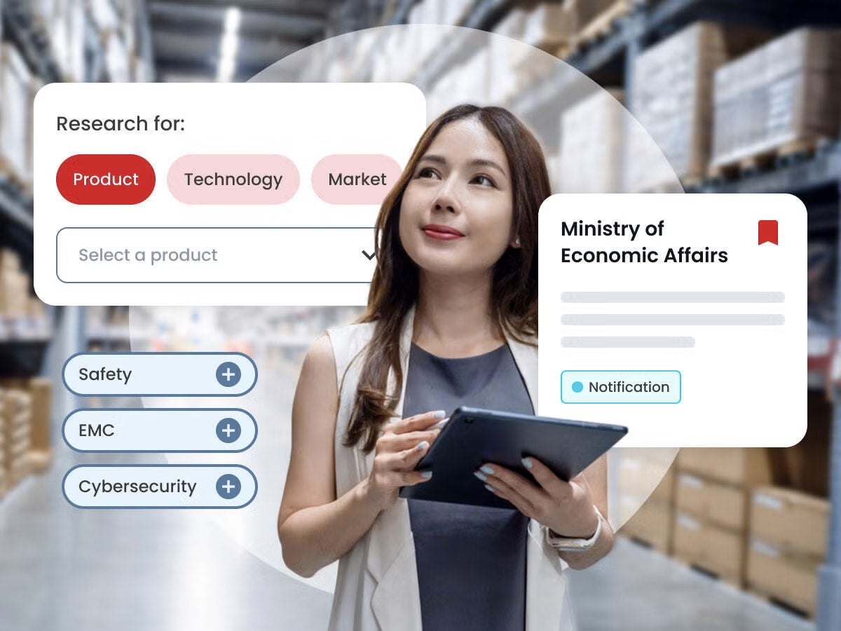 woman walking down warehouse aisle and searching for info on tablet device