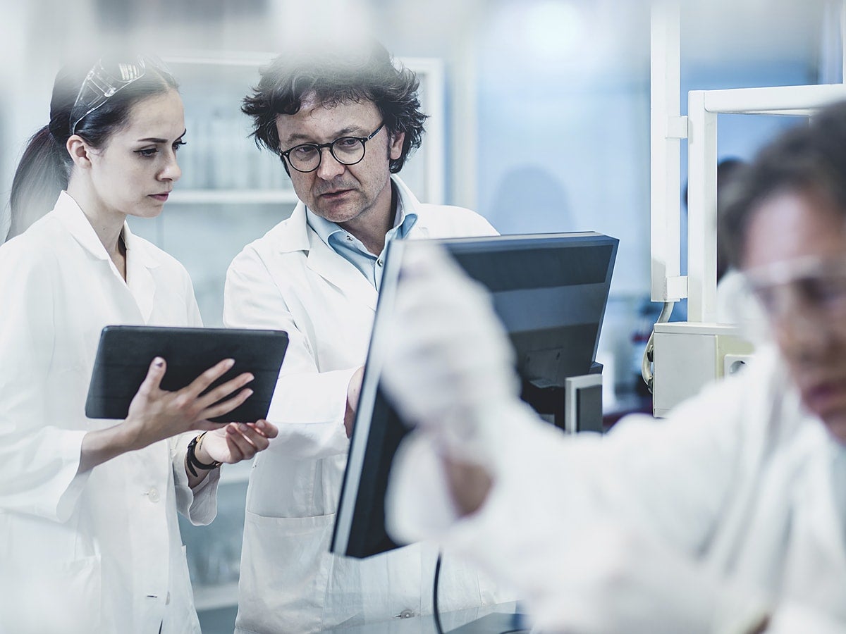 Scientists collaborating in a lab.