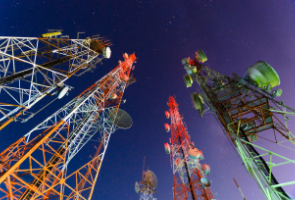 A view from the bottom of cellphone towers
