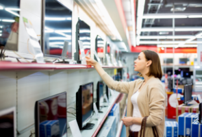 A person looking at new monitors