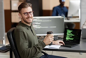 Smiling person at his work desk