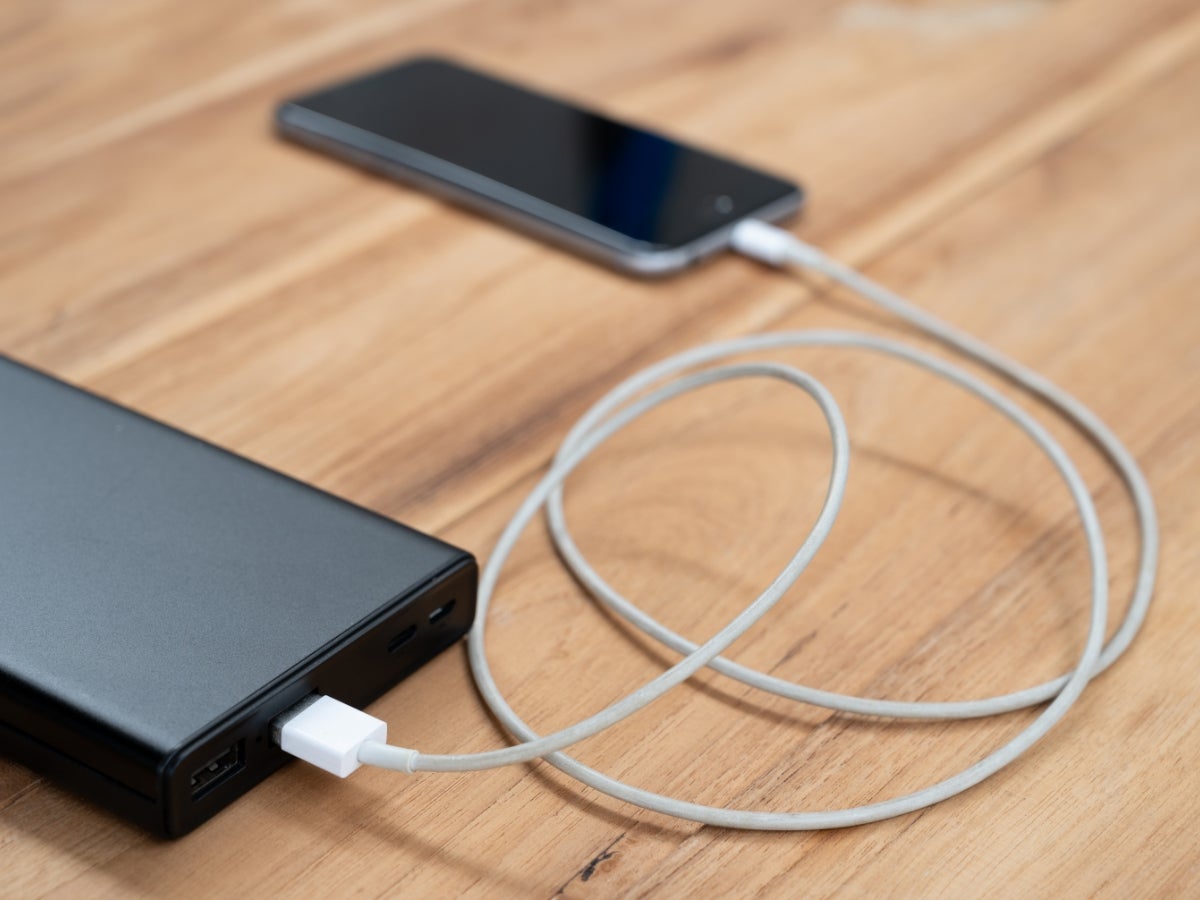 A phone being charged with a power bank