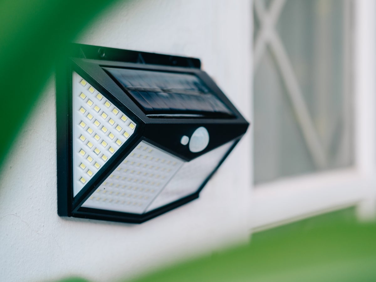 An outdoor solar light along a walkway
