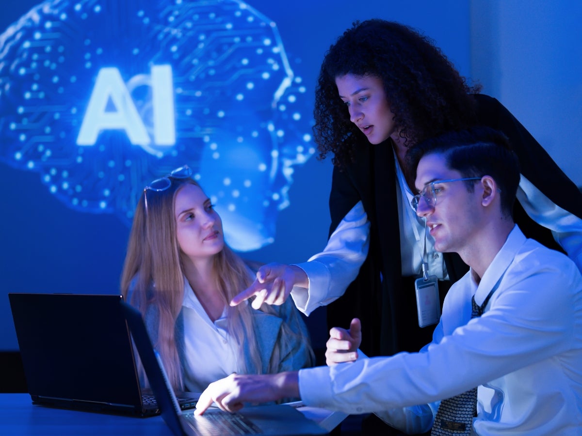 Three business professionals meeting to artificial intelligence
