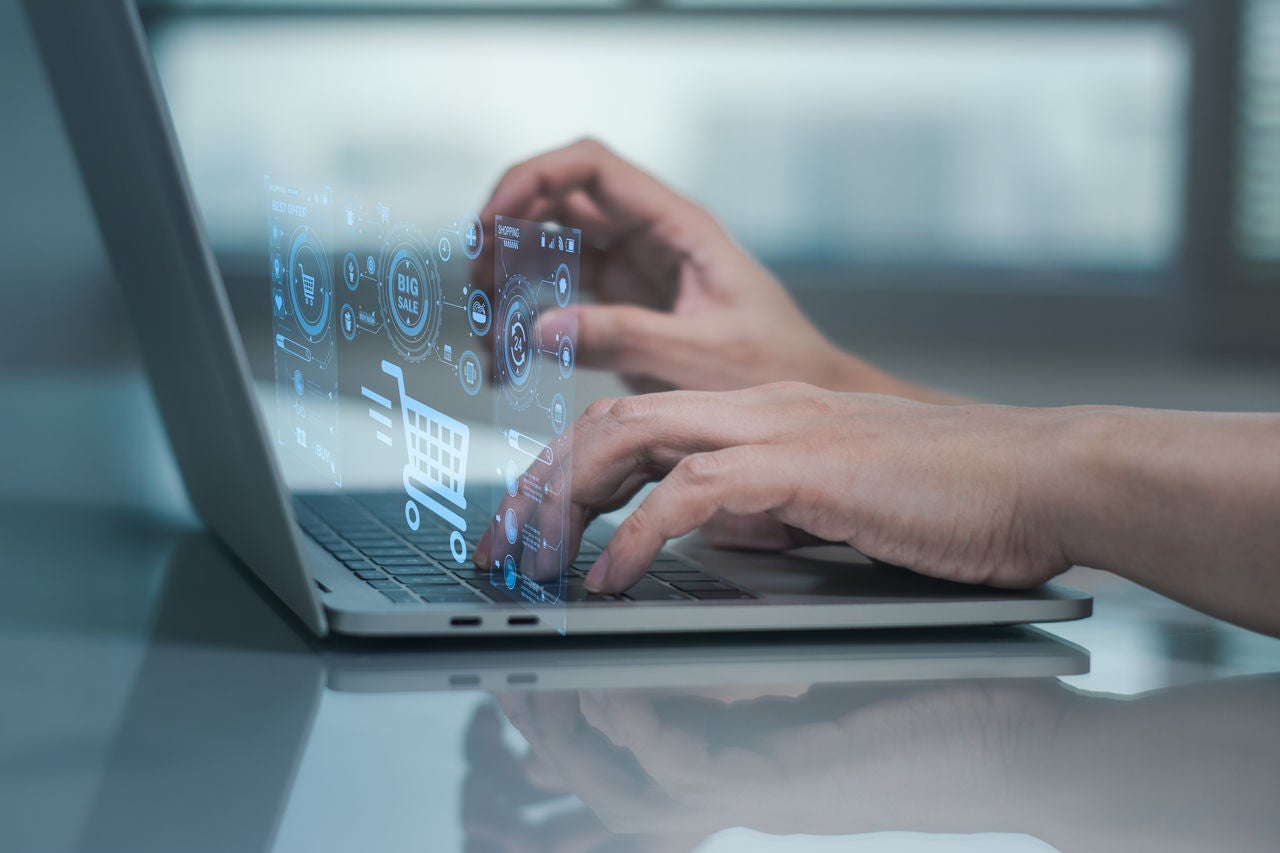person typing on laptop