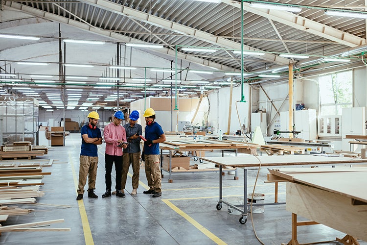 People standing on factory floor