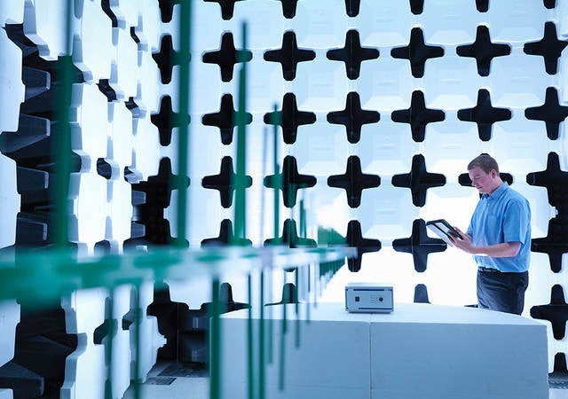 Man conducting electromagnetic compatibility (EMC) testing 