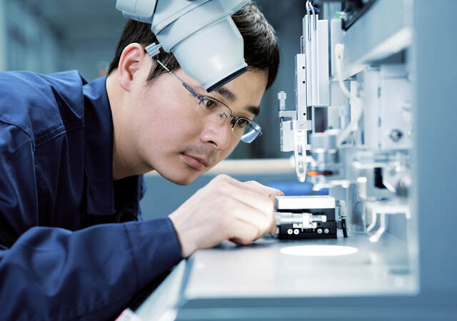 Man looking at test instrument