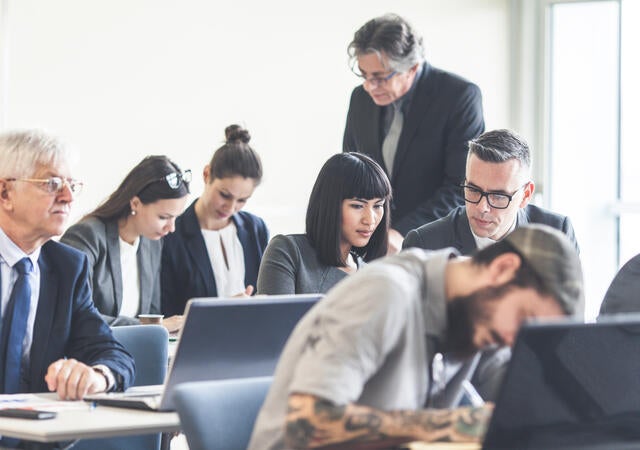 Business people attending a seminar