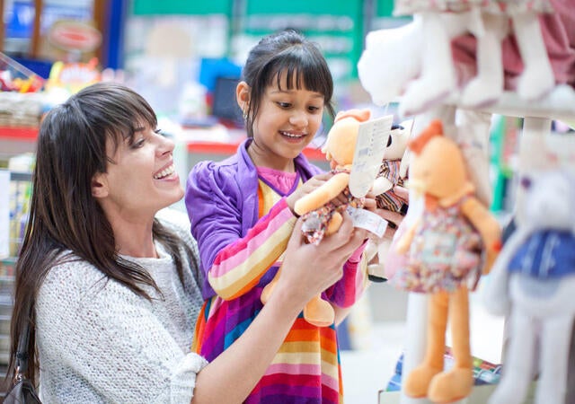 Mother and child looking at toys